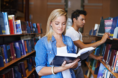 Buy stock photo Reading, book or woman in a library to search at university, college or school campus for education. Bookshelf, learning or smart student with scholarship studying knowledge, research or information
