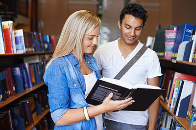 Buy stock photo Teamwork, book or students reading in a library at university, college or school campus for education. Bookshelf, learning or young people with scholarship studying knowledge, research or information