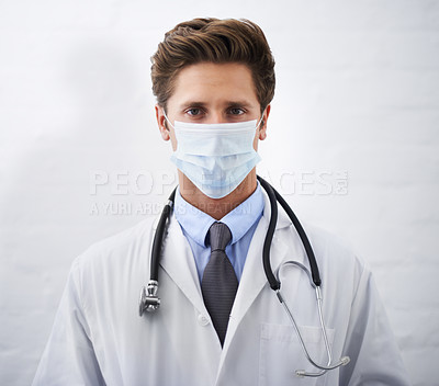 Buy stock photo Man, portrait and doctor with face mask for protection, health and safety on mockup space. Male person, surgeon or medical professional with stethoscope for healthcare on a white studio background 