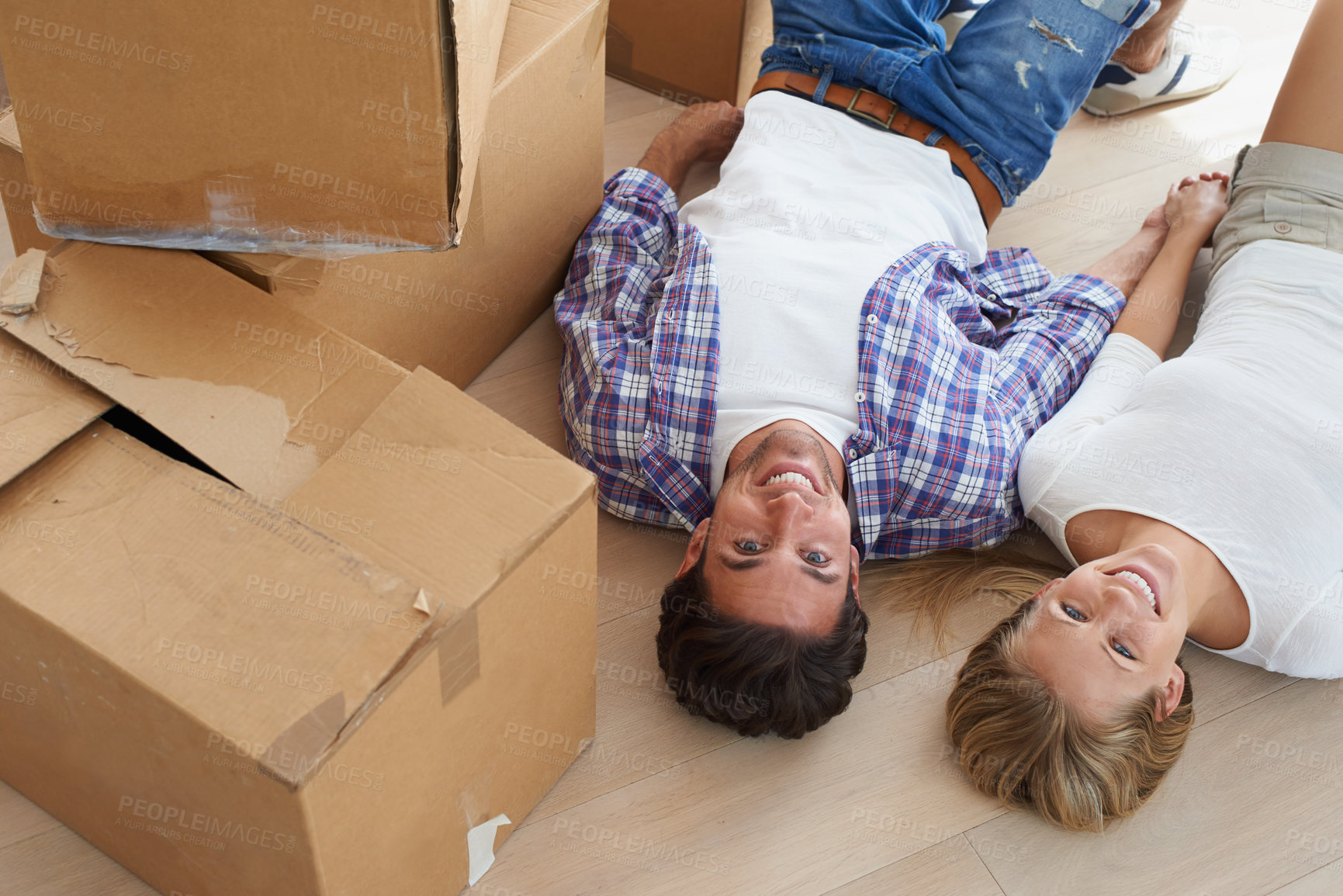 Buy stock photo Couple, boxes and happy with face for real estate, new home or property investment with romance or love. Moving, man and woman with smile or holding hands for fresh start, achievement and dream house