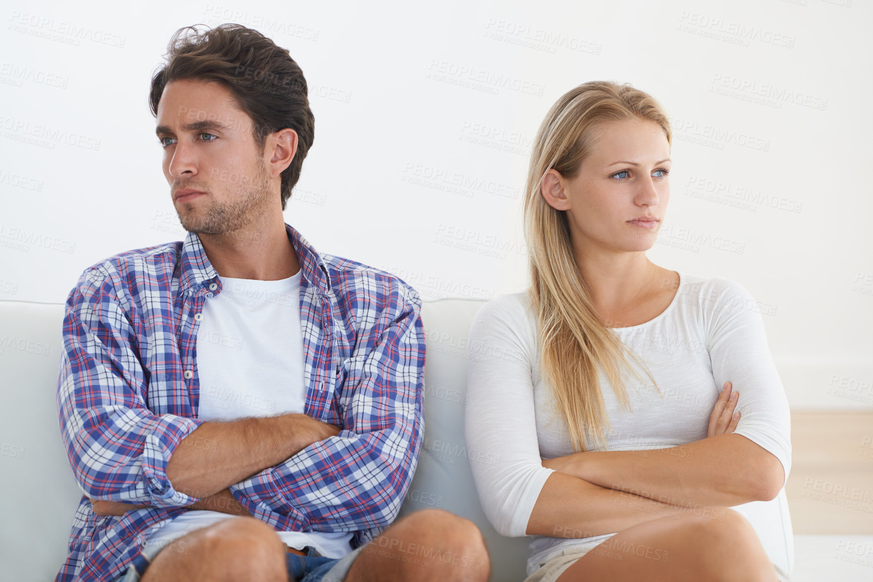 Buy stock photo Couple, angry and living room couch with disagreement, upset and thinking with anger, fight or mad. Divorce, betrayal and relationship with cheating, stress and argument for marriage, home or toxic