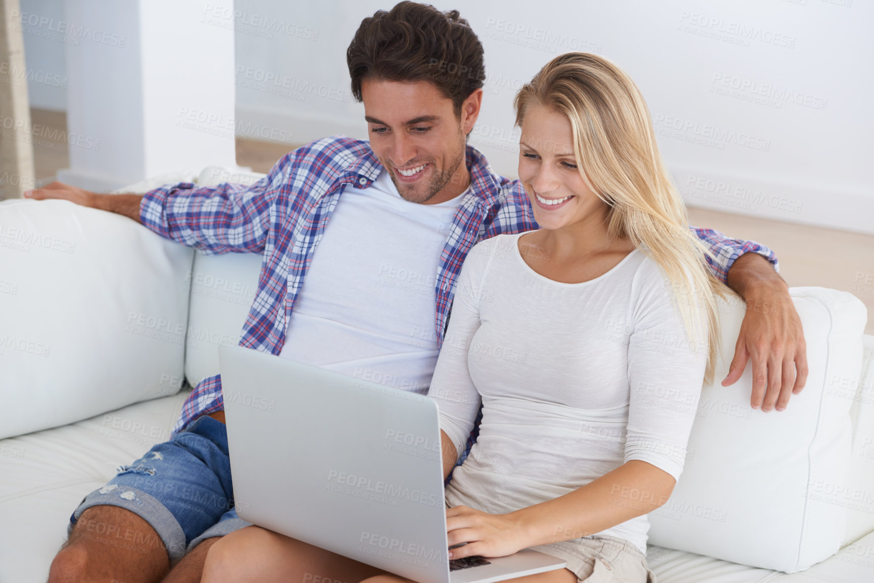 Buy stock photo Couple, smile and laptop on sofa in home for movie, social media or web streaming with bonding and love. Technology, man and woman on couch with computer pc for internet scroll and tv show with care 