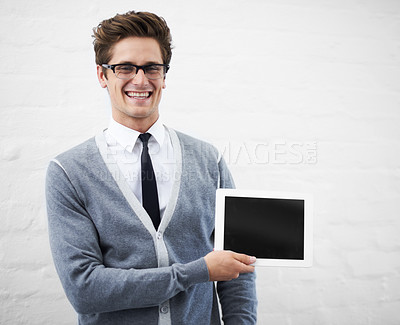 Buy stock photo Happy man, tablet and screen for advertising or marketing against a gray studio background. Portrait of person, nerd or geek smile with technology display or mockup space for advertisement, UI or UX