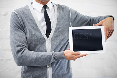 Buy stock photo Man, hands and tablet screen for advertising or marketing against a gray studio background. Closeup of male person or employee showing technology display or mockup space for advertisement, UI or UX