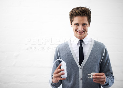 Buy stock photo Business man, portrait and plug with connection, cable or smile for electricity by wall background. Person, employee or entrepreneur with space, mockup and happy for power, energy or sustainability