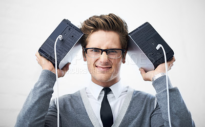 Buy stock photo Face, database and storage on hard drive with man in studio on gray background for safety or security. Portrait, cloud computing and glasses with nerd or geek IT professional holding equipment