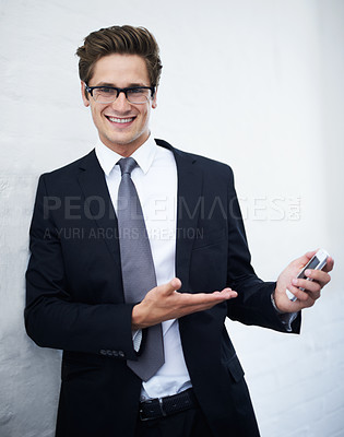 Buy stock photo Businessman, smartphone and smile for networking, communication and corporate clothes. Offering, professional and happiness for business conversation, consulting and financial chartered accountant