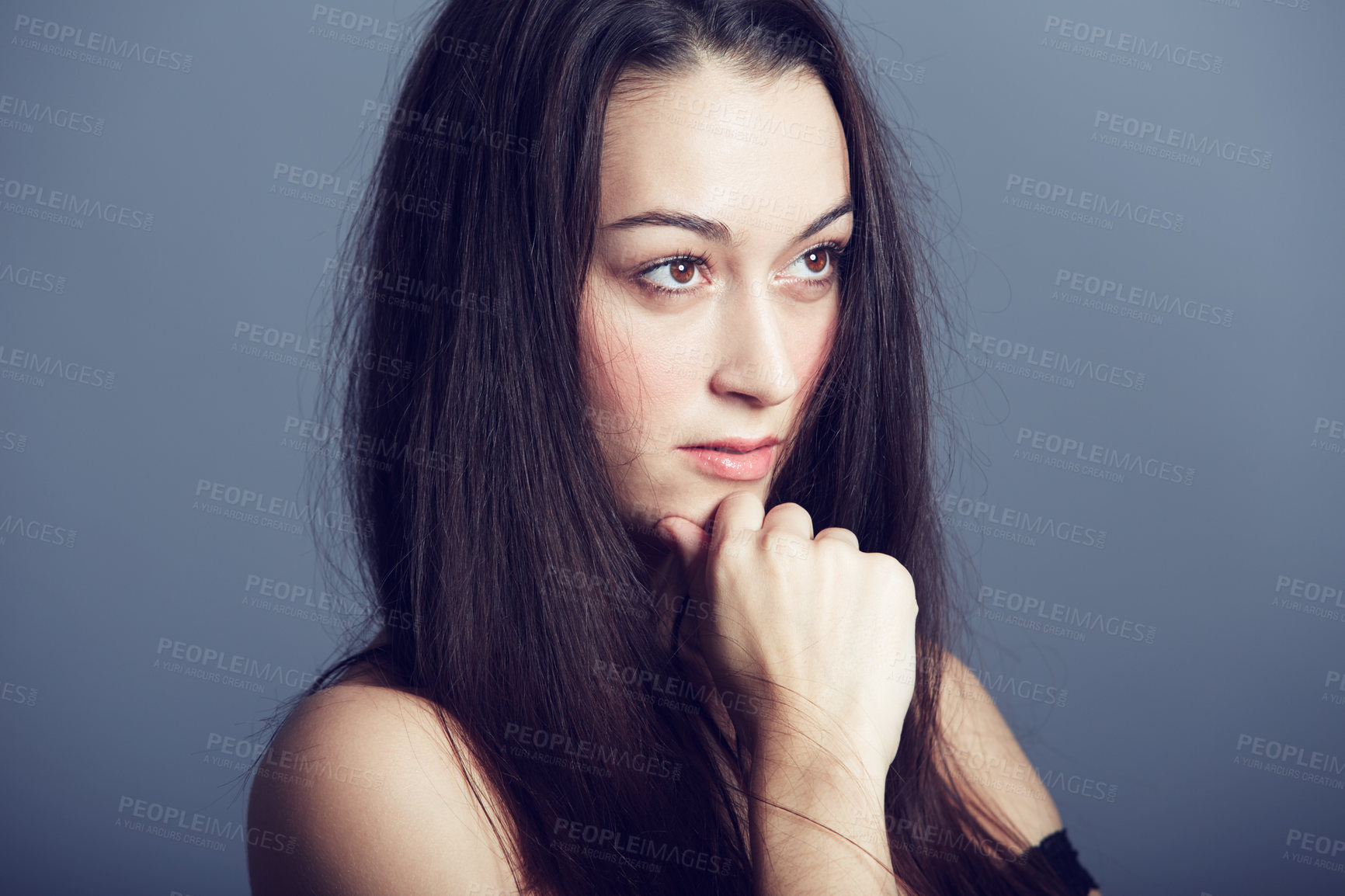 Buy stock photo a beautiful brunette looking ahead of her in deep thought