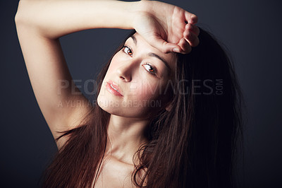Buy stock photo Portrait of a beautiful brunette with her hands to her forehead