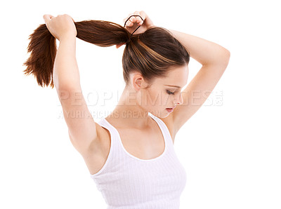 Buy stock photo Hair, beauty and mockup with a woman in studio isolated on a white background for natural or keratin treatment. Haircare, cosmetics and tying with a young female posing to promote her hairstyle