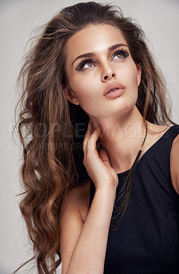 Buy stock photo Beauty, makeup and hair care model thinking with edgy eyeliner aesthetic and hairstyle volume. Beautiful hair of young woman with salon cosmetic treatment shine on gray studio background


