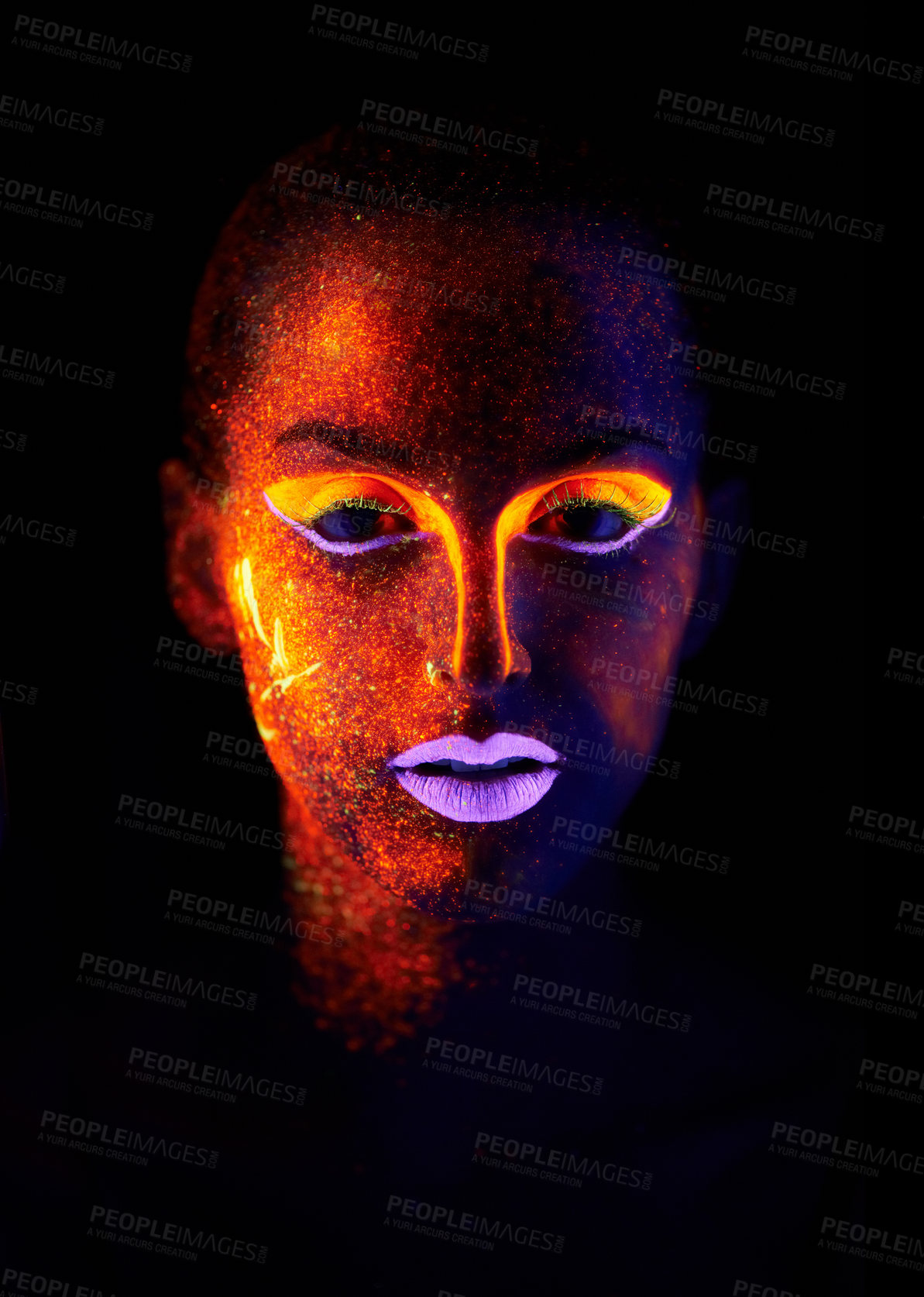 Buy stock photo A young woman with with neon paint on her face posing