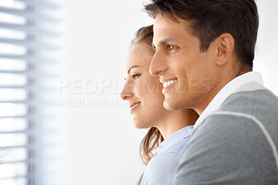 Buy stock photo Couple, hug and happy or bonding by window, peaceful and romance in relationship or marriage. People, support and love in embrace, commitment and loyalty in partnership and trust or unity together