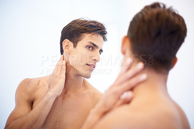 Buy stock photo Man, mirror and thinking on skincare and beauty in bathroom, cosmetics and dermatology or facial treatment. Male person, reflection and grooming in morning routine, hygiene and wellness or care