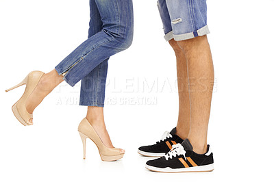 Buy stock photo Cropped image of a man and woman's feet as they stand together in a romantic pose