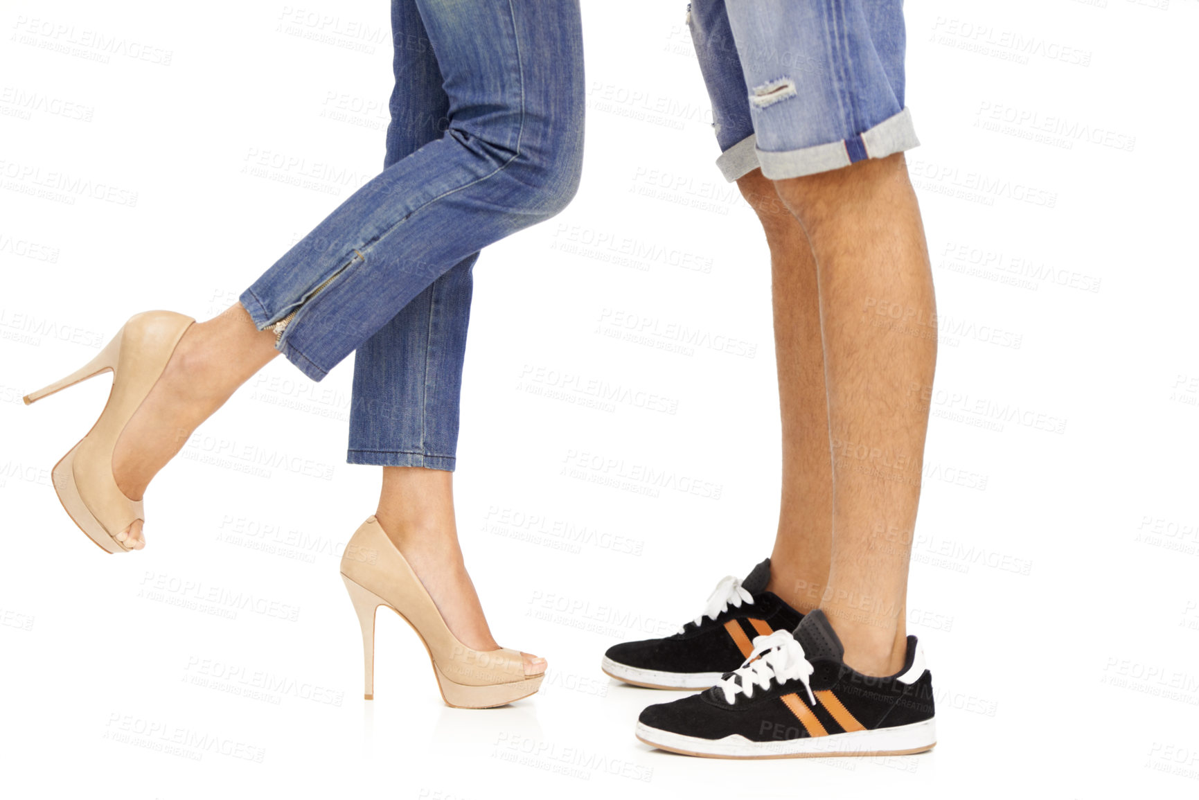 Buy stock photo Cropped image of a man and woman's feet as they stand together in a romantic pose