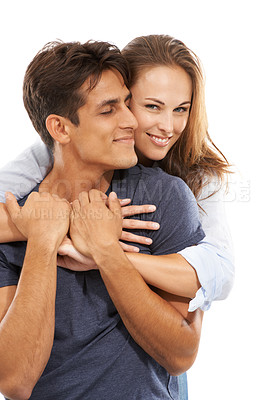 Buy stock photo Happy couple, hug and love in care, compassion or trust for embrace against a white studio background. Handsome man and young woman smile for romance, affection or relationship together on mockup