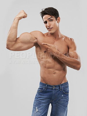 Buy stock photo Man, portrait and biceps or bodybuilder pride in studio, wellness and fitness by gray background. Male person, arms and strong or muscular abdomen, confident and results or progress from exercise