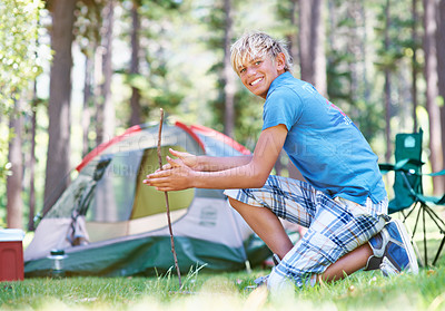 Buy stock photo Start, campfire or portrait of boy in woods for summer camp, survival education or learning. Kid, spark or happy male child on adventure with sticks or smile in nature on holiday vacation in forest