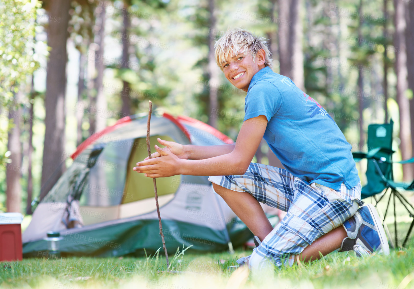 Buy stock photo Start, campfire or portrait of boy in woods for summer camp, survival education or learning. Kid, spark or happy male child on adventure with sticks or smile in nature on holiday vacation in forest