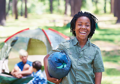 Buy stock photo A boy standing in front of his campsite