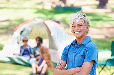 Buy stock photo Kid, portrait and relaxing on camping adventure in outdoors, happy and smiling on vacation or holiday. Male person, child and face or confident in park, childhood and summer or arms crossed in nature