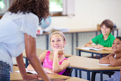 Buy stock photo Teaching, woman teacher and happy children in education, support and helping for learning development in classroom. Listening, knowledge and school expert with girl and kids talking or advice on test