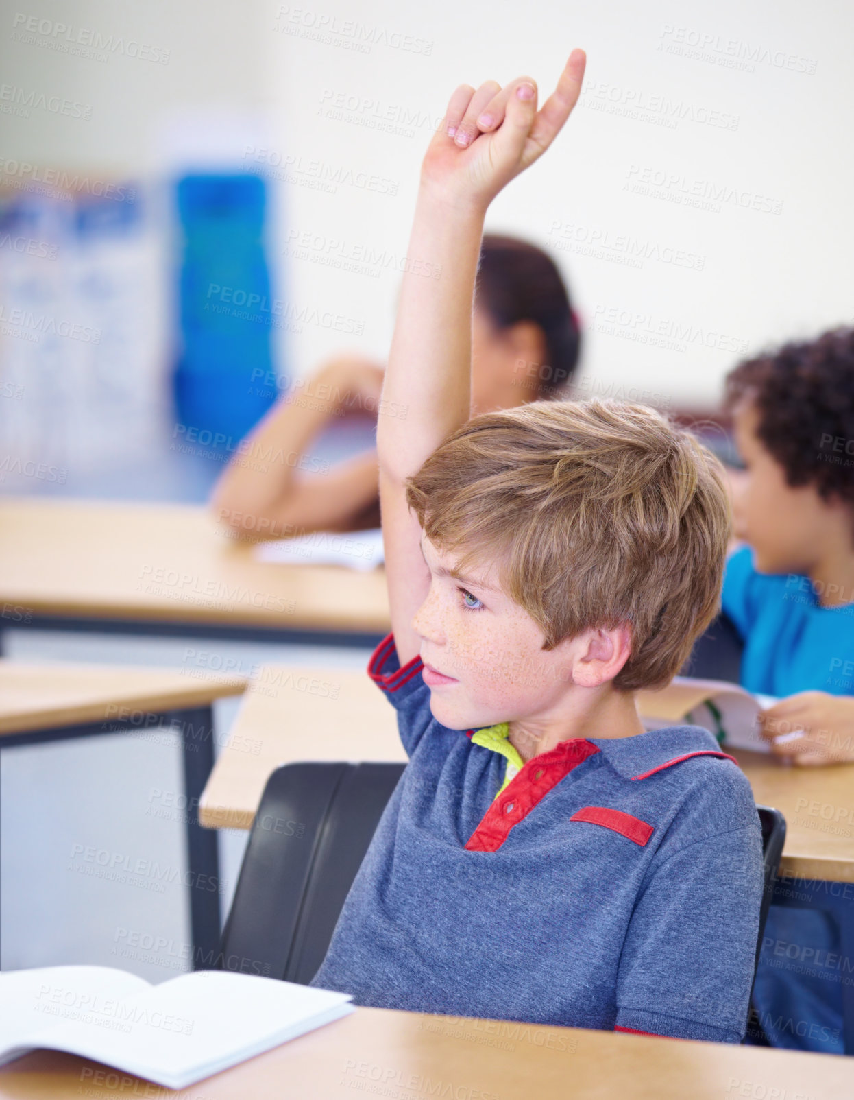 Buy stock photo Classroom, child and raise hand for questions, support and help with education and teaching in school or classroom. Young boy or kid with arm up for knowledge, learning and class answer or advice