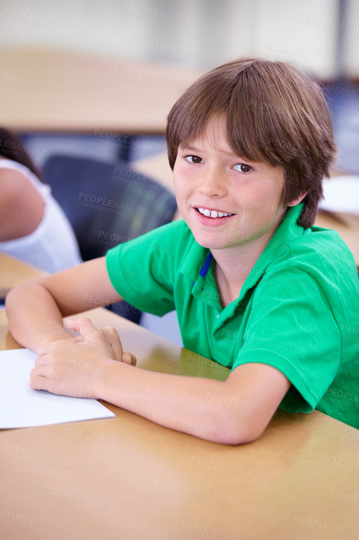 Buy stock photo Portrait, happy child or student in classroom for knowledge, education or development for future growth. School, smart boy or clever kid with book, smile or pride for studying or learning at desk 