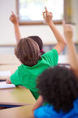 Buy stock photo Classroom, raise hands and children rear for questions, education and language learning or quiz in school. Young group, kindergarten or clever kids with arms up for students support, ideas or answer