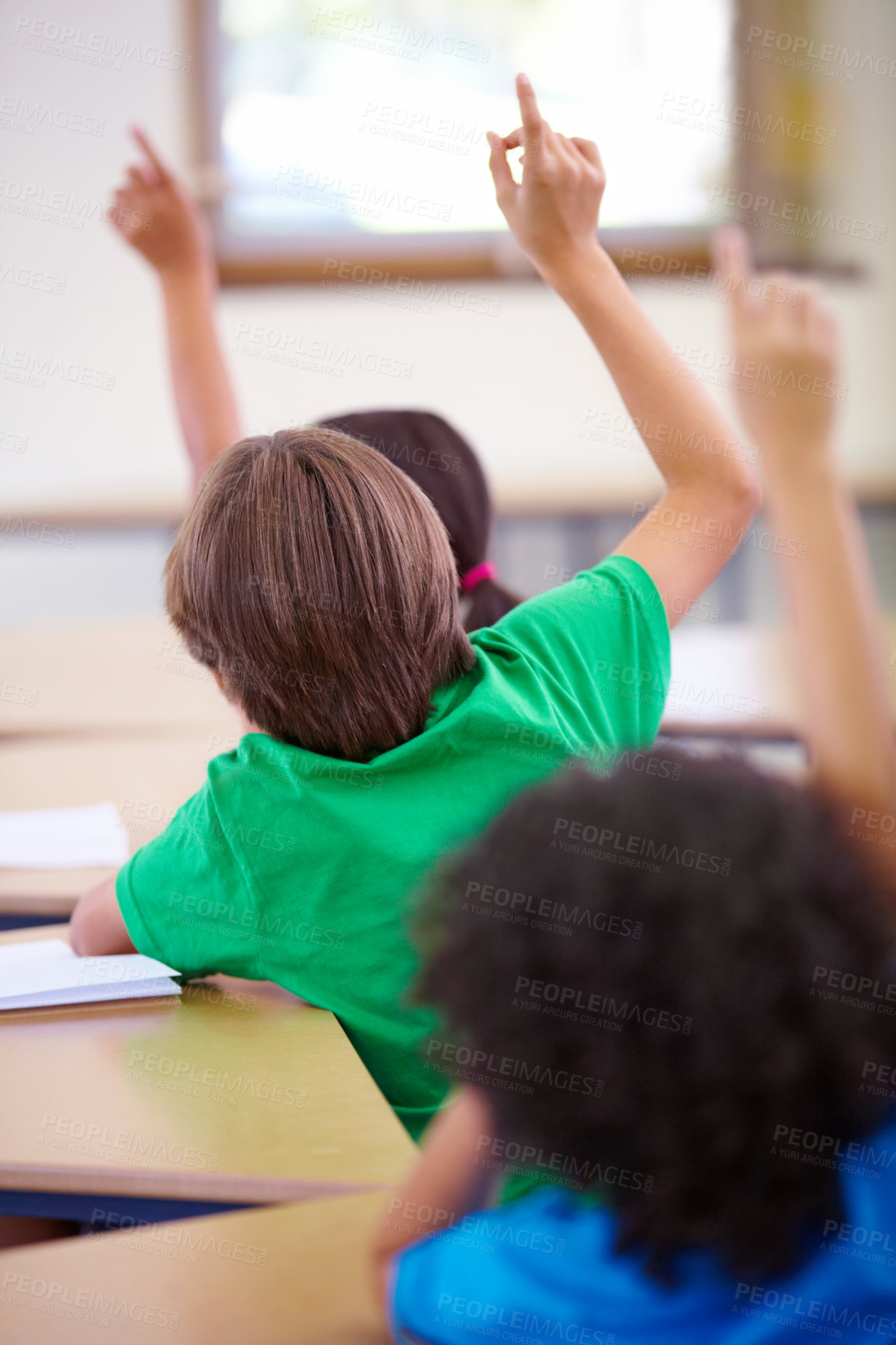 Buy stock photo Classroom, raise hands and children rear for questions, education and language learning or quiz in school. Young group, kindergarten or clever kids with arms up for students support, ideas or answer