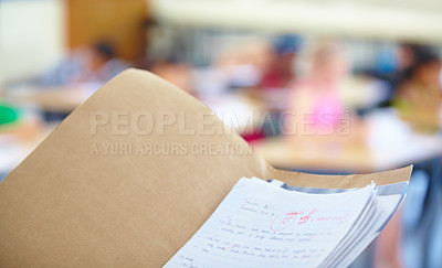 Buy stock photo Classroom, test papers and marks for exams, school and files for students, results and folder. Closeup, academic and education for grading, childhood and person for assignments, scholar and reports