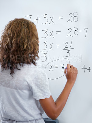 Buy stock photo Woman, teacher and writing on whiteboard for mathematics, numbers or equations in classroom. Rear view of female person, educator or lecturer with sum on board for learning or problem solving class