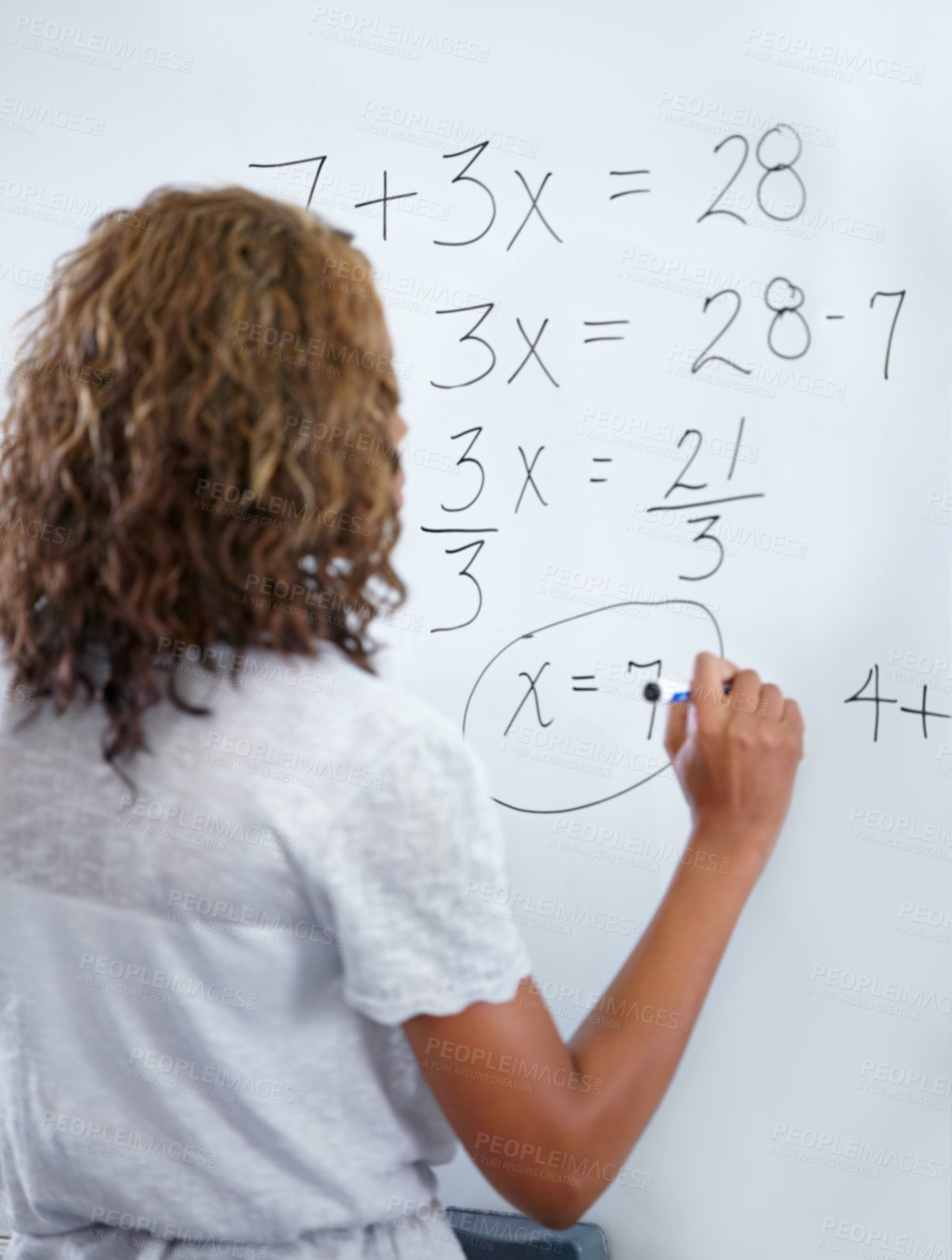 Buy stock photo Woman, teacher and writing on whiteboard for mathematics, numbers or equations in classroom. Rear view of female person, educator or lecturer with sum on board for learning or problem solving class