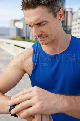 Buy stock photo Man, fitness and checking watch in city for workout, exercise or monitoring outdoor performance. Closeup of male person or athlete looking at wristwatch for training or heart rate in an urban town