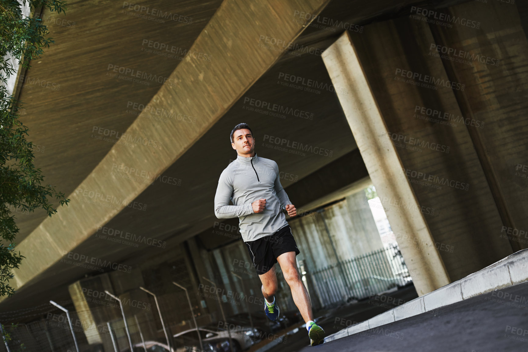 Buy stock photo Man, runner and fitness on street in outdoors, cardio and exercise or training for marathon. Male person, athlete and workout by city background, sportswear and performance challenge on asphalt