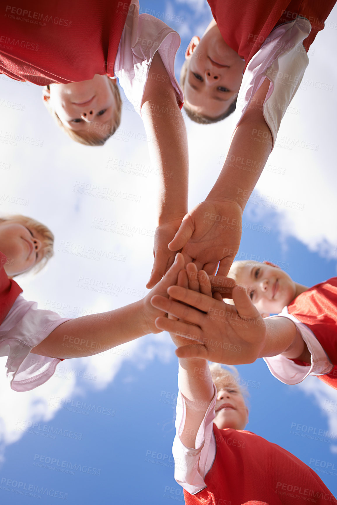 Buy stock photo Hands, support and group of children on soccer team, team building and collaboration or huddle in circle. People, solidarity and team or partnership and trust in community, unity and sky background