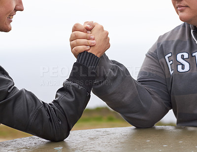 Buy stock photo Hands, friends and competition with men and arm wrestling in nature for challenge, power and respect. Team, strong and conflict with closeup of people and holding hands for muscle, match and rival