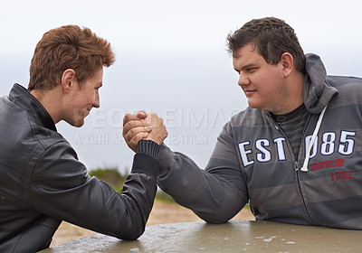 Buy stock photo Challenge, friends and competition with men and arm wrestling in nature for sport, power and respect. Team, strong and conflict with people and holding hands for muscle, match and rival in outdoors