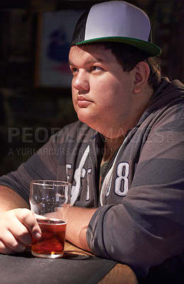 Buy stock photo Thinking, beer and drink with man at pub for lager, contemplating and alcohol. Nightlife, relaxing and restaurant with customer at table in bar for serious, brewery and weekend gathering