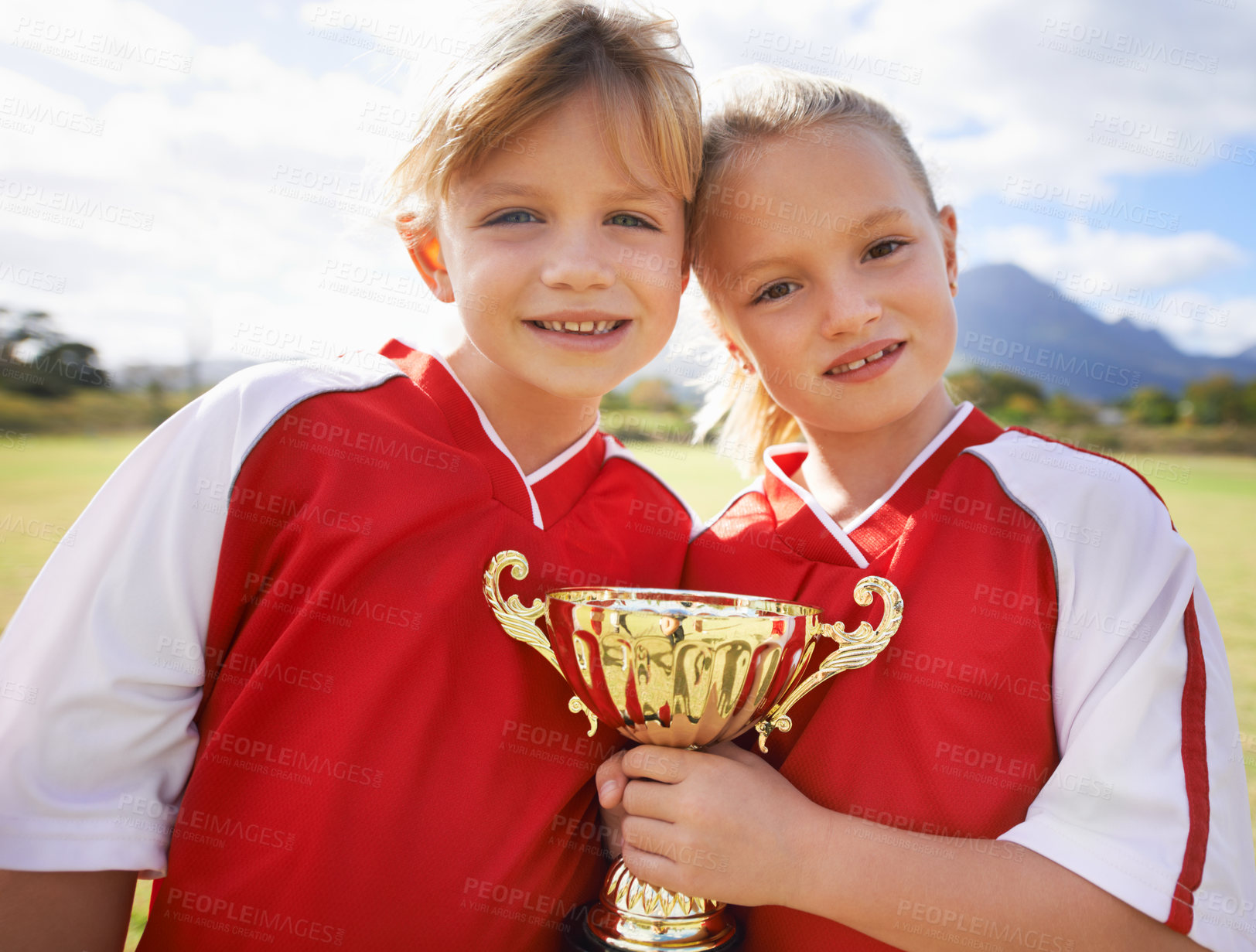 Buy stock photo Celebration, players and children with cup, soccer and girls with victory, support or proud. Achievement, sports and friendship, together and happy for win, ready for game or physical activity
