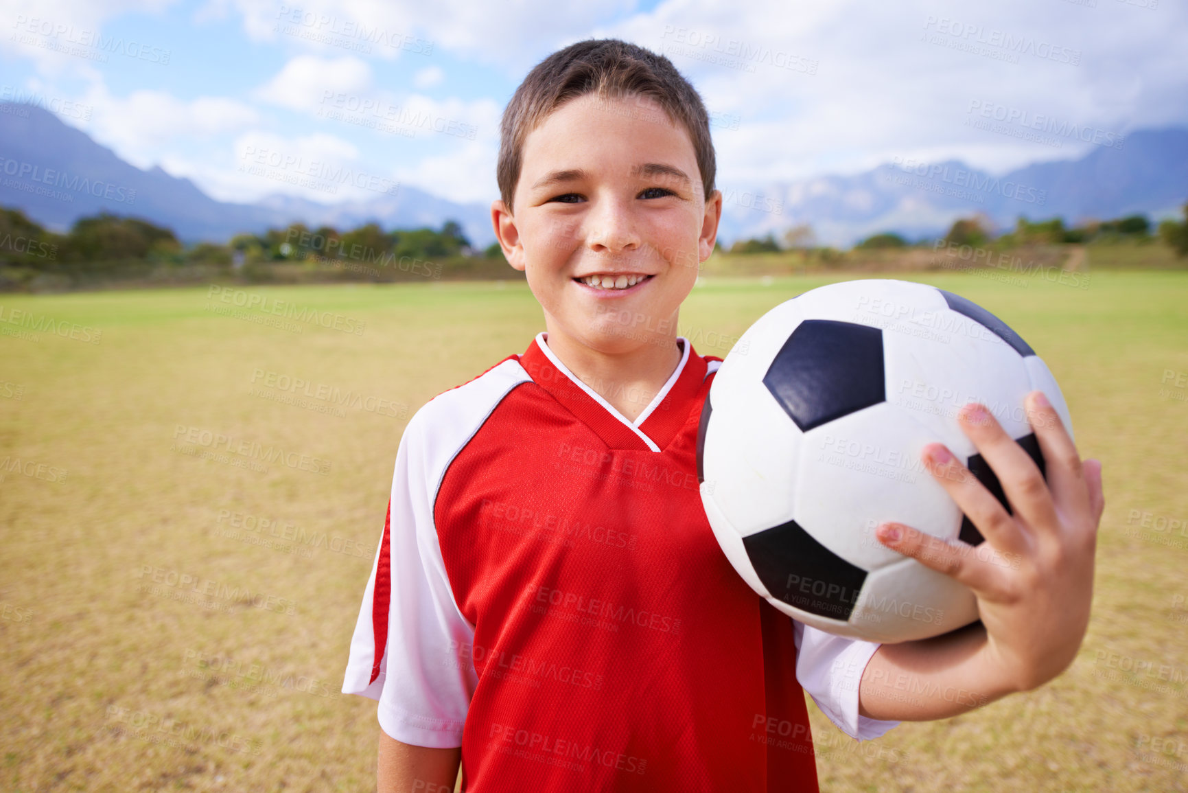 Buy stock photo Child, portrait and soccer player on field, sports and confidence for match and game. Happy boy, face and ready for competition in outdoors, smiling and practice or training for skills on grass