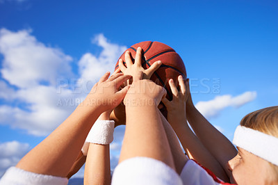 Buy stock photo People, hands and basketball in teamwork for sports motivation, unity or community with blue sky background. Group of players holding ball up in air for friendly match or outdoor game in nature 