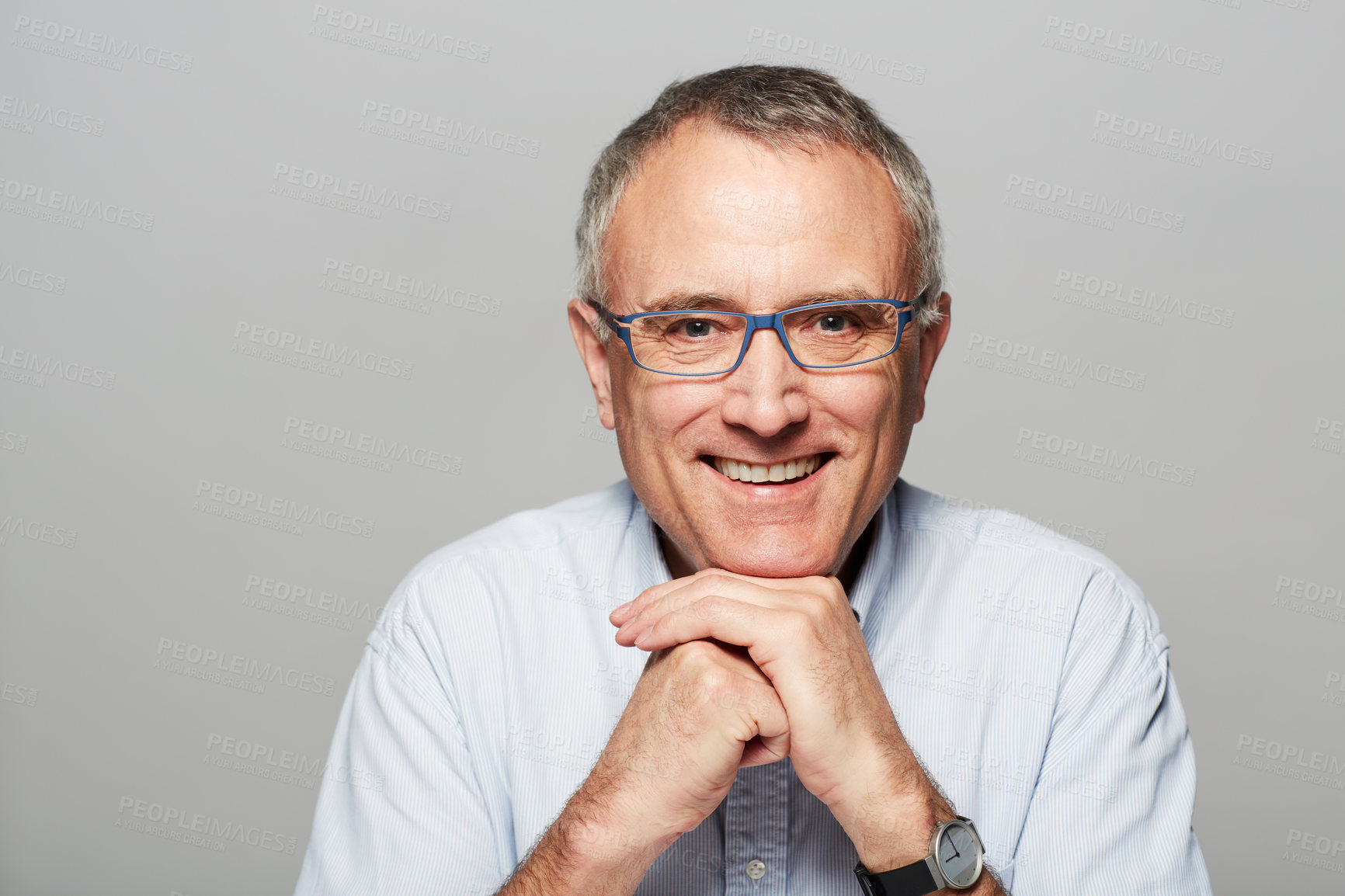 Buy stock photo Studio portrait of a mature man smiling at the camera