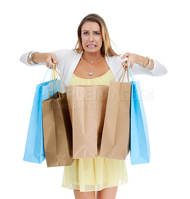 Buy stock photo Woman, shopping and oops with bags in studio portrait with expenses, surprise and white background. Model, shopping bags and isolated regret for fashion, sale and discount for spending shopaholic