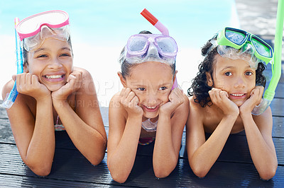 Buy stock photo Three children resting their heads on their hands and waiting to go snorkeling