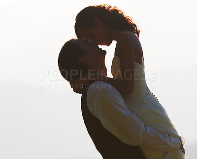 Buy stock photo Groom lifting bride, silhouette and wedding outdoor, hug with love and commitment in marriage. Man, woman and happiness, celebration and social event with mockup space, romance and life partner