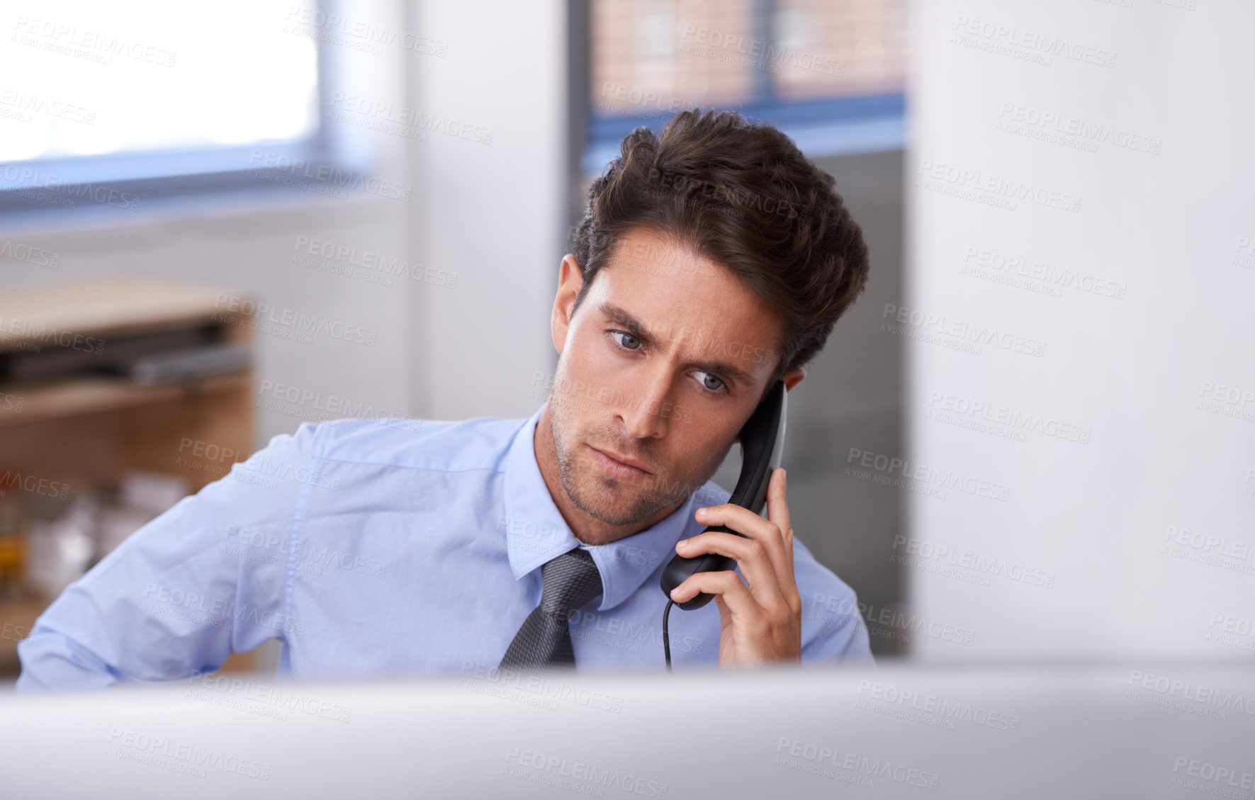 Buy stock photo Business man, phone call and networking on landline in workplace, contact and consulting in office. Businessperson, professional and communication or discussion, technology and connection for info
