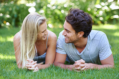 Buy stock photo Relax, love or happy couple on grass in park for date, support or care on a summer in nature together. Romance, man or woman with smile on outdoor holiday vacation for bond, travel or freedom in USA