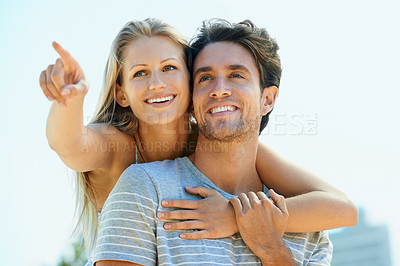 Buy stock photo Pointing, love or happy couple hug on outdoor date for support or love in summer in nature together. Relax, romantic man or woman talking with smile on holiday vacation for bond, travel or wellness